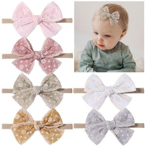 Dolce colore del suolo pizzo scava fuori bowknot fascia per capelli per bambina carino morbido nylon sottile bambini archi turbante accessori per capelli fatti a mano