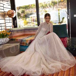 Abito da sposa in tulle con paillettes punteggiato glitterato Maniche lunghe Boho Abiti da sposa con collo alto 2022 Fodera champagne Abiti da sposa country sexy illusione con fodera champagne