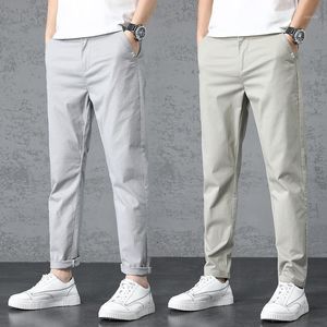 Calça masculina 2022 chegada calça calça primavera zíper de bolso de bolso respirável cor sólida mid slim fit jaceging massacho machado