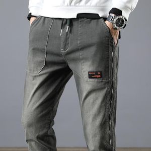 Calças masculinas Cargo de jeans solto Men da cintura elástica Stretch Hip Hop Streetwear listrado Jogging Fashion Black Pantsmen's