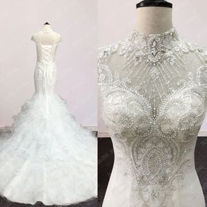 Immagine reale Abiti da sposa a sirena romantici con collo alto e maniche corte 2022 Abito da sposa a tromba con strascico con volant e applicazioni bellissime