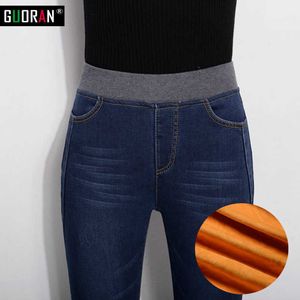 Frauen Winter warme Fleece hohe elastische Taille Jeans weibliche dünne Stretch-Denim-Bleistift-Hosen plus Größe Knöpfe lange Hosen 210608