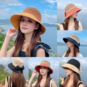 Sommar ny kvinnors fiskare hatt stickad ihålig färg matchande båge solhatt vikbar UV -skydd Straw Woven Style Beach Hat