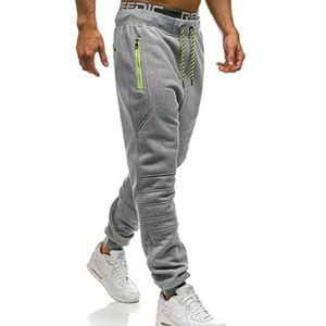 Pantaloni da uomo Pantaloni da pista cuciti con tasca con cerniera tinta unita da uomo