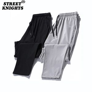 Dorywczo spodnie Mężczyźni Joggers Spodenki Solidne Kolor Elastyczny Talia Spodnie Fitness Sportswear Moda Lato Wiosna 220325
