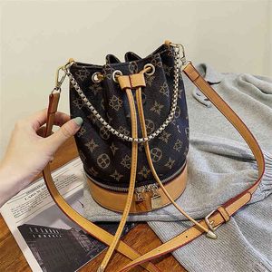 Bolsa venda saco feminino nova versão outono moda balde saco 100 transportar estilo estrangeiro corrente mensageiro cinto alça bolsa de ombro