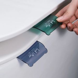 1Pc Toilet Supplies Cover Lifting Device Bathroom Toilets Lid Handle Sticker Portable Sanitary Handle Bathrooms Seat Accessories