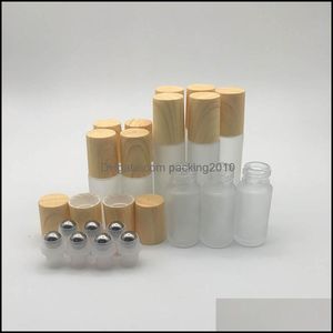 Frosted Clear Glass Roller Bottles Vials Containers With Metal Ball And Wood Grain Plastic Cap For Essential Oil Per 5Ml Drop Delivery 2021