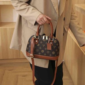 スタイルの小さなバッグ女性の新しい多目的なワンショルダーメッセンジャーシェルハンドバッグハンドバッグデザインルイジアナショップ財布