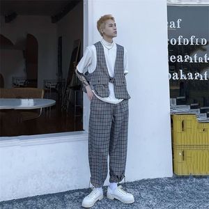 Arma de tendência de tendência de homens bonitos Coleta xadrez de verão e nicho coreano Legging calça de legging solta