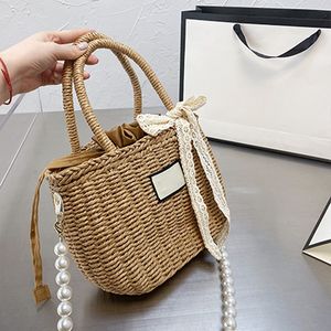 Högkvalitativ 2022 Nya modestrånspåsar Pearl Chain Portable Bucket Påsar Foreign Style Messenger Rattan stor kapacitet Handväskor Kålkorg Holiday Seaside G