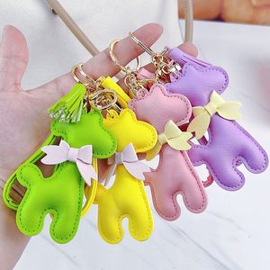 Portachiavi in pelle Ciondolo giraffa Portachiavi Regali Accessori per gioielli Design della moda femminile Cinturino in PU Fiocco Chiavi per auto Anello Fob Macaron Borsa per animali Fascino Portachiavi Titolare