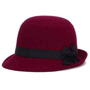 ht1215ブランドはウールを模倣した無地の黒い冬の暖かいバケツ帽子の女性のための短いブリムフェドーラキャップとリボンボウ卸売