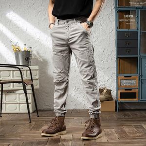 Calças masculinas de estilo coreano Men jeans Jeans Spliced ​​Designer Cargo casual macacão de rua de rua Hip Hop Harém HAREMERS HOLEMEN NAOM