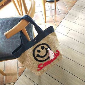 New Korean Ins Straw Woven Bag Cute Embroidered Smiling Face Beach Bag Seaside Holiday Tassel Handbag 220514