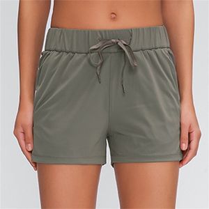 Shorts para mulheres com pregão de bolsos executando shorts esportivos 4 vias trecho tecido 220419