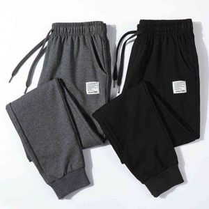 Spodnie fitness Mężczyźni bawełniane nowe spodnie dresowe piepty streetwearowe Modne spodni sznurka na pełną długość dla mężczyzn Casual Spods 4xl G220713