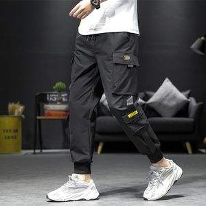 Calça punk de harém preto de hip hop masculino de peças elásticas da cintura elástica com fitas casuais calças de corredor fino homens calças de hip hop 220816