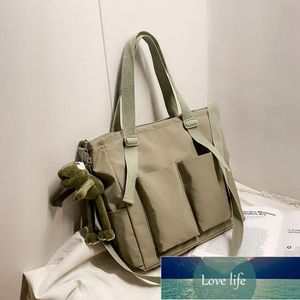 Borsa a tracolla da donna nuova moda semplice primavera borsa a tracolla di grande capacità per studenti di colore solido artistico in stile coreano