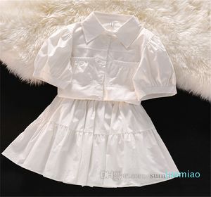 Moda-preppy estilo infantil cenas de roupas meninas lapela solteiro camisa de manga de sopro saia 2pcs verão garotas grandes roupas de princesa branca