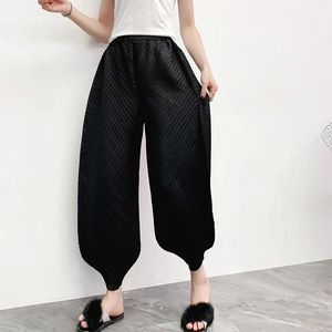 Calças femininas Capris Miyake Pregas Please Harem Winter Solto Elástico Cintura Sólida Até o Tornozelo Estilo Inglaterra Tamanho Grande Moda Feminina Tamanho Livre