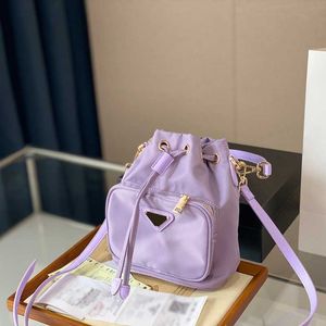 Bolsas de grife femininas casuais bolsas tiracolo mochilas de lona feminina estilosa bolsa de ombro com estampa de letras mochila de luxo 22 cm