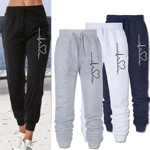 Lösa joggare breda kvinnor män elastiska midja sportbyxor tryck byxor par fritid streetwear unisex solida sweatpants 220325