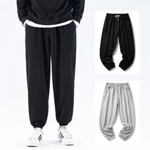 Höst och vinter bomullsbyxor män fleece solid elastisk midja streetwear baggy byxor avslappnad trendig vild 220330