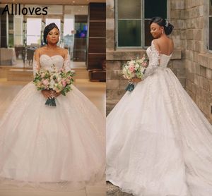 African Ball Gown Wedding Dresses With Long Sleeves Sheer Neck Lace Appliqued Puffy Skirt Sweep Train Plus Size Vestidos De Novia Corset Back Bride Formal Wear CL0512