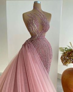 ユニークなピンクのウエディングドレス袖のないスパンコールのパーティードレスチュールフロアの長さセクシーな控えめなカスタムメイドのイブニングドレス