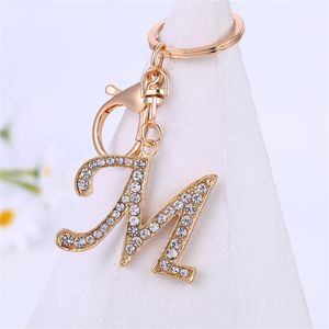 26 Letter Crystal Rhinestone liga de chave Charme Charme Gold Chave Anel Favor Favory Chave de carro Ornamentos de sacos de bolsa Accessores