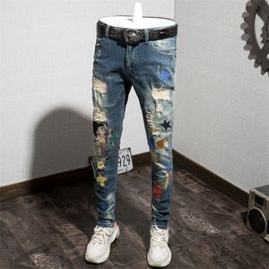 Осенняя мужская дыра джинсы Личность печать мужских брюк Тенденция непосредственно брюки без манжеты Эластичная сила.