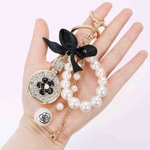 Bow-Knot Imitation Pearl Perfume Crystal Bottle Iron Tower Chain Keychain Car Key Ring Bag Charm Accessories Girl Keyring Gift AA220318