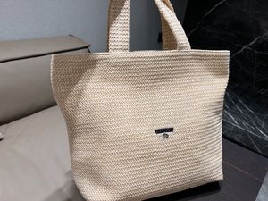 2022 Lyxiga kvinnor gräs väv handväskor designers shoppingkassar dam stora plånböcker mode casual totes stjärna märkesmönster kontrast färg med dammpåse storlek 32cm