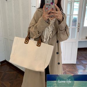 En-shoulder canvas aftonväska ny fransk bärbar stor väska stor kapacitet mångsidiga kvinnors tygväskor