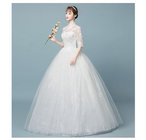 Populaire half mouw hoge kraag bruid jurk eenvoudig patroon borduurwerk sexy backless kant bruidsjurken