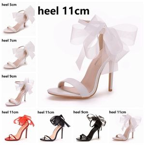 Crystal Queen Frau Süße Schleife Knoten Elegante Knöchelriemen Party Sandalen Schwarz Dünne High Heels Weiße Hochzeitsschuhe Offene spitze 220328