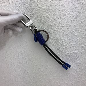 Luxury keychain with black and electric blue taiga leather woven with padlock