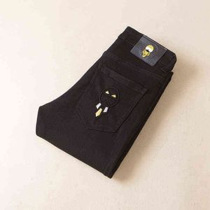 Vinterhöst jeans herrmode koreansk version smal passform små fötter elastiska mångsidiga svarta avslappnade byxor