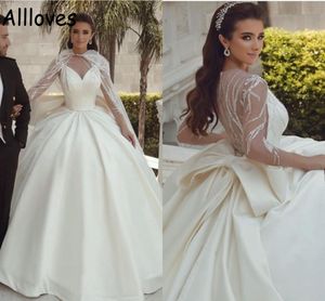 Błyszczące cekinowe Dubai Arabian Ball Suknie ślubne z okładami perełek Sheer szyi długie rękawy Eleganckie satynowe suknie ślubne Puffy spódnica vestidos de novia cl0303