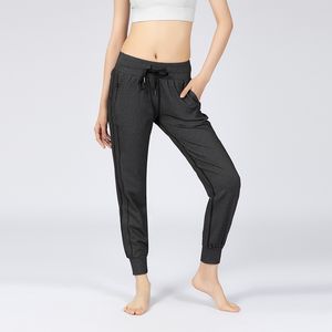 Pantaloni da jogging sportivi da allenamento in tessuto al tatto nudo Pantaloni sportivi da corsa fitness con coulisse in vita da donna con due tasche laterali