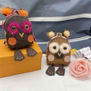 Luxury Mink Fur Owl KeyChain Famous Brand Mini Ryggsäck Keychains Flower hörlurar Väska Dekoration Tillbehör Mynt Pursegrfnk1