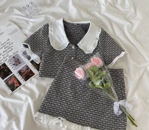 Mode-Dame-Stil Kinder karierte Kleidung Sets große Mädchen Falbala Revers Kurzarm-Shirt + Patchwork-Farbrock 2 Stück Sommer Kinder Outfits fi