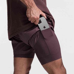 2022 Frühjahr neue einheitliche Farbe innen und außen doppelschichtige Shorts Herren kurze integrierte Tasche Bermuda Quick Dry Beach Shorts Y220420