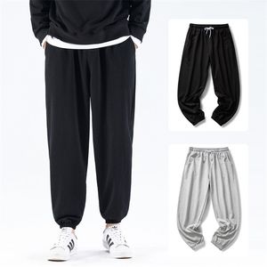 Höst och vinter bomullsbyxor män fleece solid elastisk midja streetwear baggy byxor avslappnad trendig vild 220325