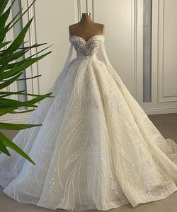 Unikalna koronkowa suknia balowa suknie ślubne z koralików kryształowych cekinowych cekinowych sukni ślubnych z długim rękawem