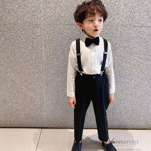 Wholesale white ruffle pants for sale - Group buy Boys gentleman clothes sets kids Bows tie ruffle white shirt suspender pants children birthday party performance outfits Q7798