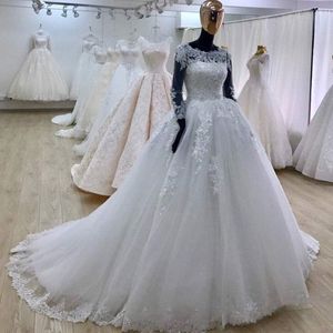 Gorgeous Ball Gown Bröllopsklänning Anpassad Bröllopsklänning från Kina Sheer Neck Lace Appliques Långärmad Puffy Tulle Bridal Gowns