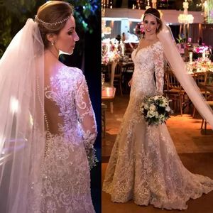 Abiti da sposa Sweetheart Appliques a pizzo pieno in rilievo illusione cristallo in perline Sheer Back con maniche lunghe a bottone Plus size abiti da sposa