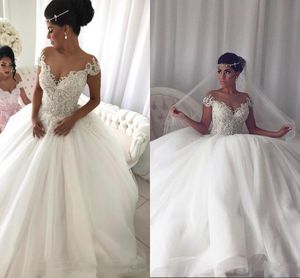 Luxury Arabic GOOD Lace 2019 Wedding Dresses Sheer Neck Beaded Cap Sleeves Tulle Gowns Vintage Sexy Bridal Gowns